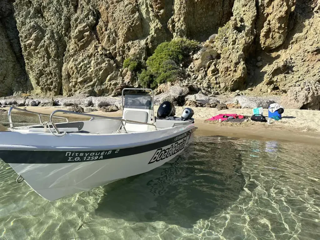 Tempest rental boat at a beach in crystal-clear water